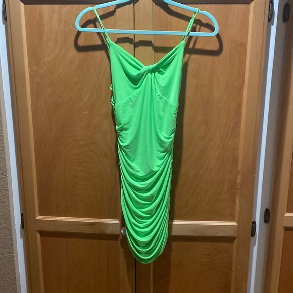 fluorescent green spaghetti strap mini dress. 96% Polyester 4% spandex. - Picture 1 of 2
